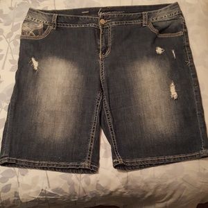 Medium blue distressed blue jean shorts. Plus size